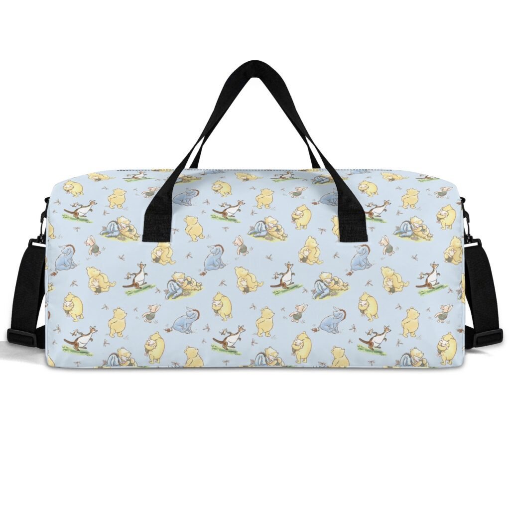 Minimalist, blue Winnie the Pooh duffle bag with black handles and shoulder strap